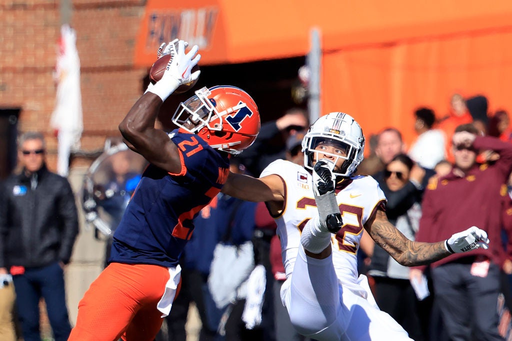 CHAMPAIGN, ILLINOIS - OCTOBER 15: Jartavius Martin #21 of the Illinois Fighting Illini intercepts a pass intended for Michael Brown-Stephens #22 of the Minnesota Golden Gophers during the second half at Memorial Stadium on October 15, 2022 in Champaign, Illinois. (Photo by Justin Casterline/Getty Images)