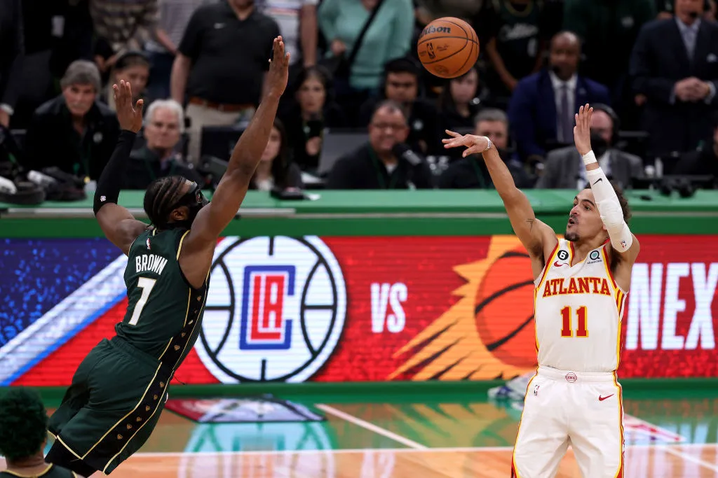 BOSTON, MASSACHUSETTS - APRIL 25: Trae Young #11 of the Atlanta Hawks shoots the game winning 29-foot three point basket against Jaylen Brown #7 of the Boston Celtics during the fourth quarter in game five of the Eastern Conference First Round Playoffs at TD Garden on April 25, 2023 in Boston, Massachusetts. (Photo by Maddie Meyer/Getty Images)