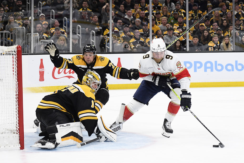 Apr 30, 2023; Boston, Massachusetts, USA; Florida Panthers center Sam Bennett (9) controls the puck in front of Boston Bruins goaltender Jeremy Swayman (1) while defenseman Charlie McAvoy (73) defends during the second period in game seven of the first round of the 2023 Stanley Cup Playoffs at TD Garden. Mandatory Credit: Bob DeChiara-USA TODAY Sports