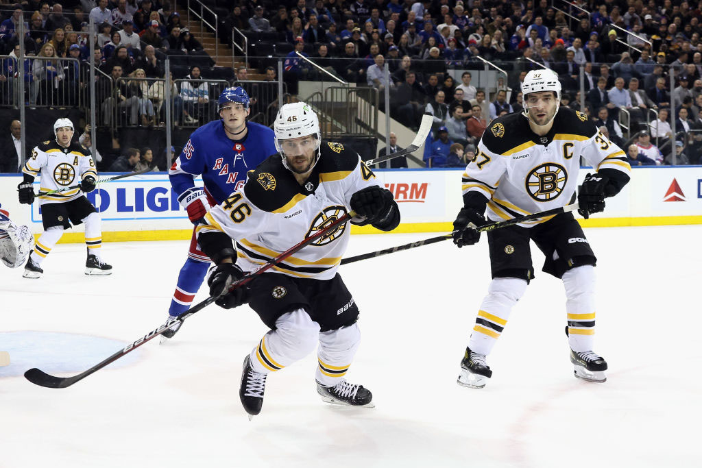 NEW YORK, NEW YORK - JANUARY 19: David Krejci #46 and Patrice Bergeron #37 of the Boston Bruins skate against the New York Rangers at Madison Square Garden on January 19, 2023 in New York City. The Bruins defeated the Rangers 3-1. (Photo by Bruce Bennett/Getty Images )
