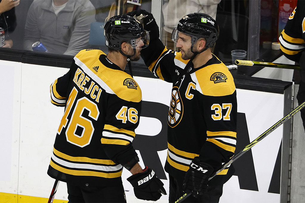 Oct 25, 2022; Boston, Massachusetts, USA; Boston Bruins center Patrice Bergeron (37) congratulates center David Krejci (46) after their 3-1 win over the Dallas Stars at TD Garden. Mandatory Credit: Winslow Townson-USA TODAY Sports