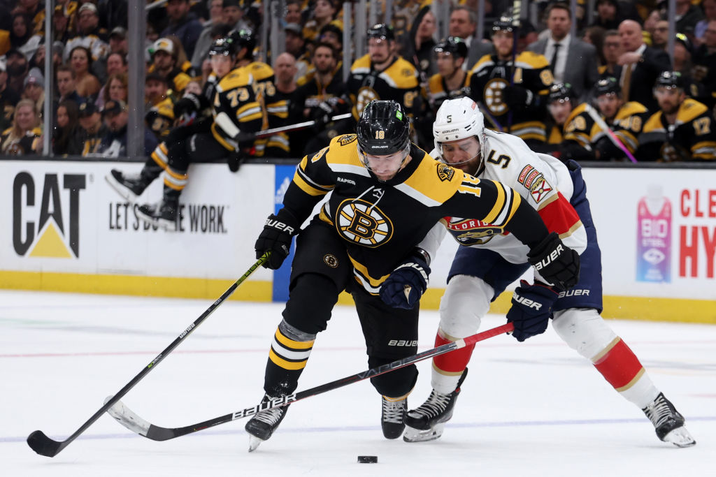 BOSTON, MASSACHUSETTS - APRIL 19: Aaron Ekblad #5 of the Florida Panthers and Pavel Zacha #18 of the Boston Bruins battle for control of the puck during the first period of Game Two of the First Round of the 2023 Stanley Cup Playoffs at TD Garden on April 19, 2023 in Boston, Massachusetts. (Photo by Maddie Meyer/Getty Images)