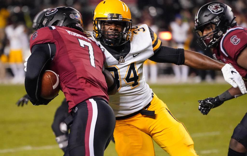 Nov 9, 2019; Columbia, SC, USA; Appalachian State Mountaineers linebacker Jourdan Heilig (34) tackles South Carolina Gamecocks quarterback Dakereon Joyner (7) during the second half at Williams-Brice Stadium. Credit: Jim Dedmon-USA TODAY Sports