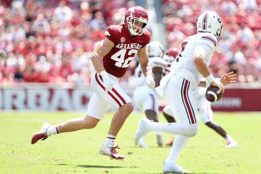 Sep 10, 2022; Fayetteville, Arkansas, USA; Arkansas Razorbacks linebacker Drew Sanders (42) pursues South Carolina Gamecocks quarterback Spencer Rattler (7) during the second half at Donald W. Reynolds Razorback Stadium. Arkansas won 44-30. Credit: Nelson Chenault-USA TODAY Sports