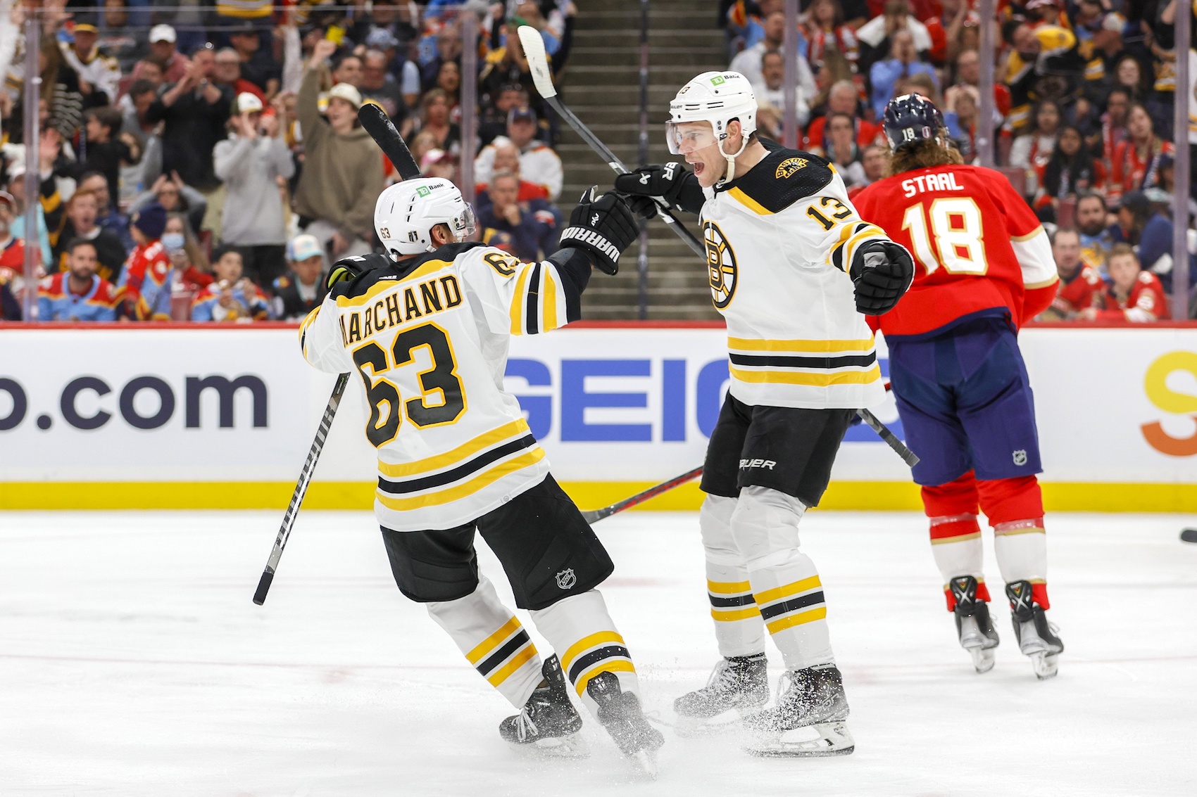 Apr 21, 2023; Sunrise, Florida, USA; Boston Bruins center Charlie Coyle (13) celebrates with left wing Brad Marchand (63) after scoring during the second period against the Florida Panthers in game three of the first round of the 2023 Stanley Cup Playoffs at FLA Live Arena. Mandatory Credit: Sam Navarro-USA TODAY Sports