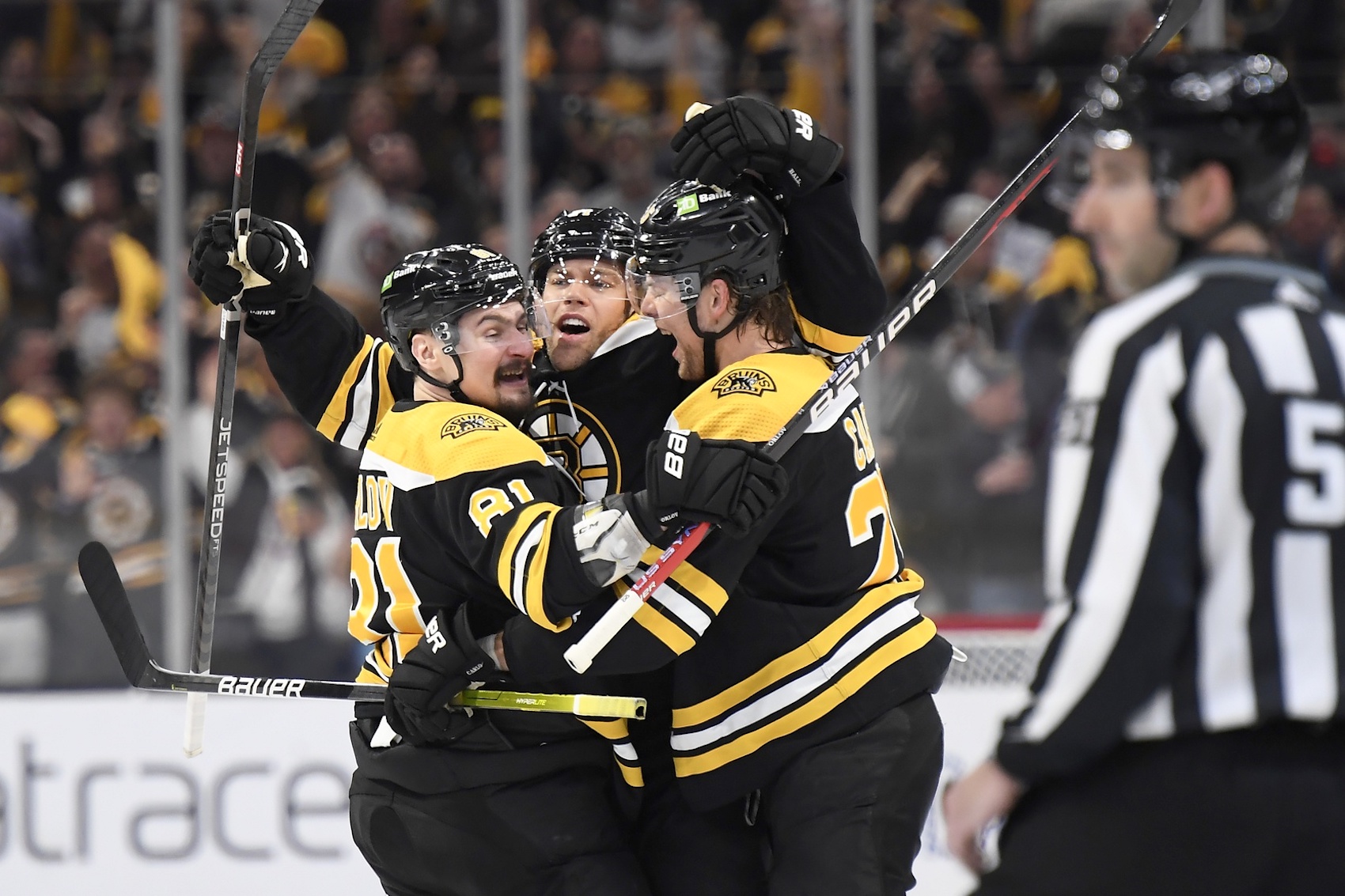 Apr 26, 2023; Boston, Massachusetts, USA; Boston Bruins left wing Taylor Hall (71) (middle) celebrates his goal with defenseman Dmitry Orlov (81) and defenseman Brandon Carlo (25) during the third period in game five of the first round of the 2023 Stanley Cup Playoffs against the Florida Panthers at TD Garden. Mandatory Credit: Bob DeChiara-USA TODAY Sports