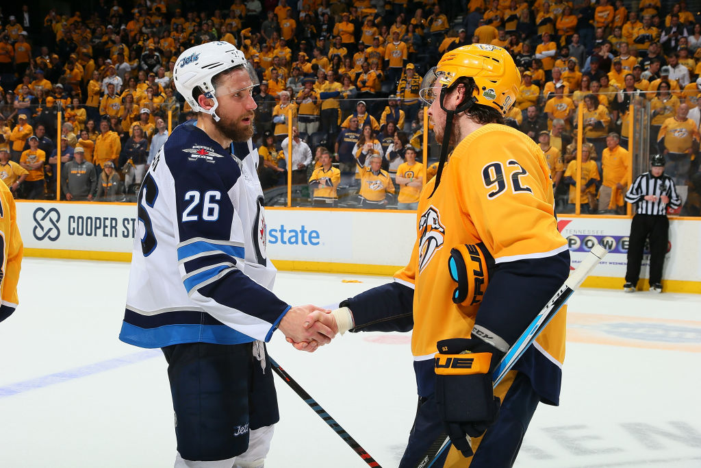 NASHVILLE, TN - MAY 10: Ryan Johansen #92 of the Nashville Predators congratulates Blake Wheeler #26 of the Winnipeg Jets after a 5-1 Jets Victory in Game Seven of the Western Conference Second Round during the 2018 NHL Stanley Cup Playoffs at Bridgestone Arena on May 10, 2018 in Nashville, Tennessee. (Photo by Frederick Breedon/Getty Images)