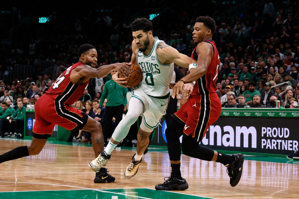 BOSTON, MA - NOVEMBER 30: Haywood Highsmith #24 of the Miami Heat and Kyle Lowry #7 try to stop Jayson Tatum #0 of the Boston Celtics during the second half at TD Garden on November 30, 2022 in Boston, Massachusetts. (Photo By Winslow Townson/Getty Images)