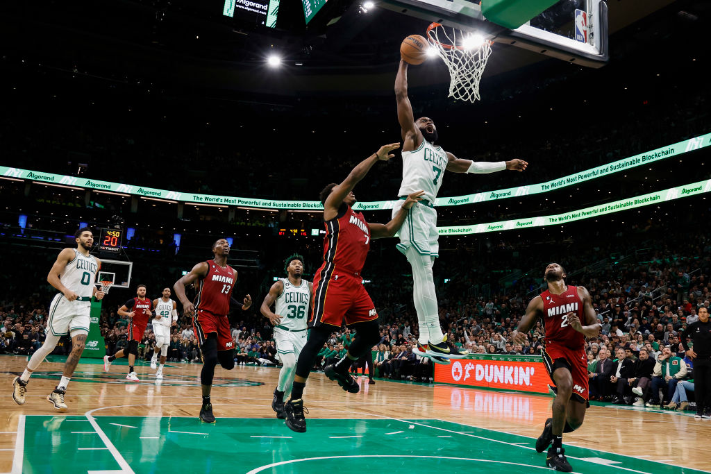 BOSTON, MA - NOVEMBER 30: Jaylen Brown #7 of the Boston Celtics goes in to dunk over Kyle Lowry #7 of the Miami Heat during the second half at TD Garden on November 30, 2022 in Boston, Massachusetts. (Photo By Winslow Townson/Getty Images)