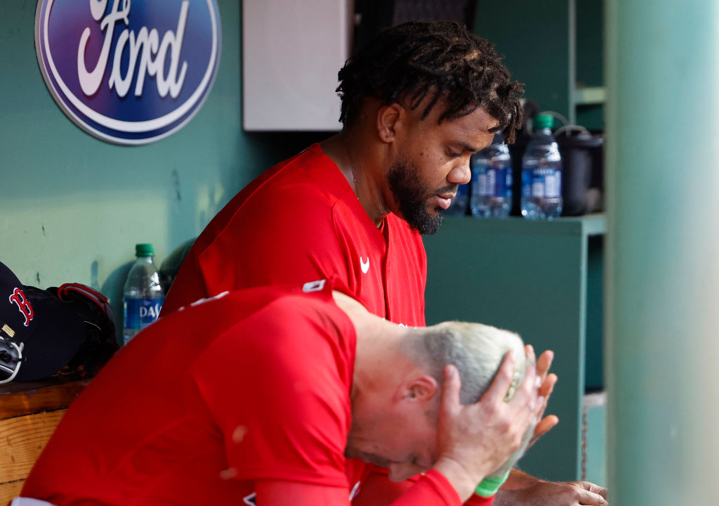 BOSTON, MA - MAY 13: As Enrique Hernandez #5 of the Boston Red Sox holds his head in his hands, pitcher Kenley Jansen #74 hangs his head after hiving up three runs to the St. Louis Cardinals during the ninth inning in their 4-3 loss at Fenway Park on May 13, 2023 in Boston, Massachusetts. (Photo By Winslow Townson/Getty Images)