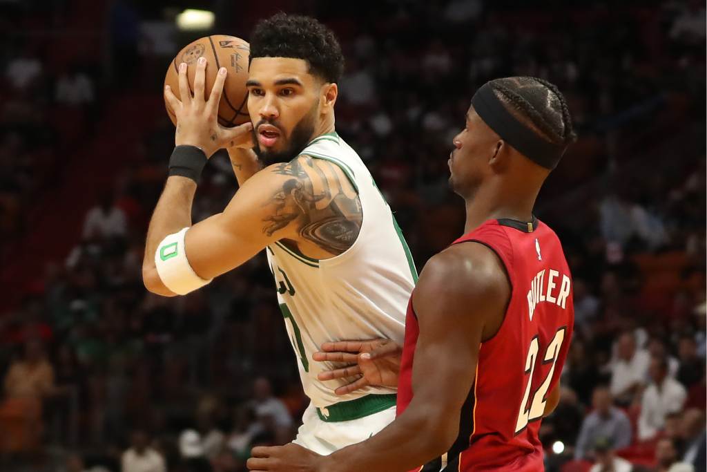 MIAMI, FLORIDA - OCTOBER 21: Jimmy Butler #22 of the Miami Heat guards Jayson Tatum #0 of the Boston Celtics during the first quarter at FTX Arena on October 21, 2022 in Miami, Florida. (Photo by Megan Briggs/Getty Images)