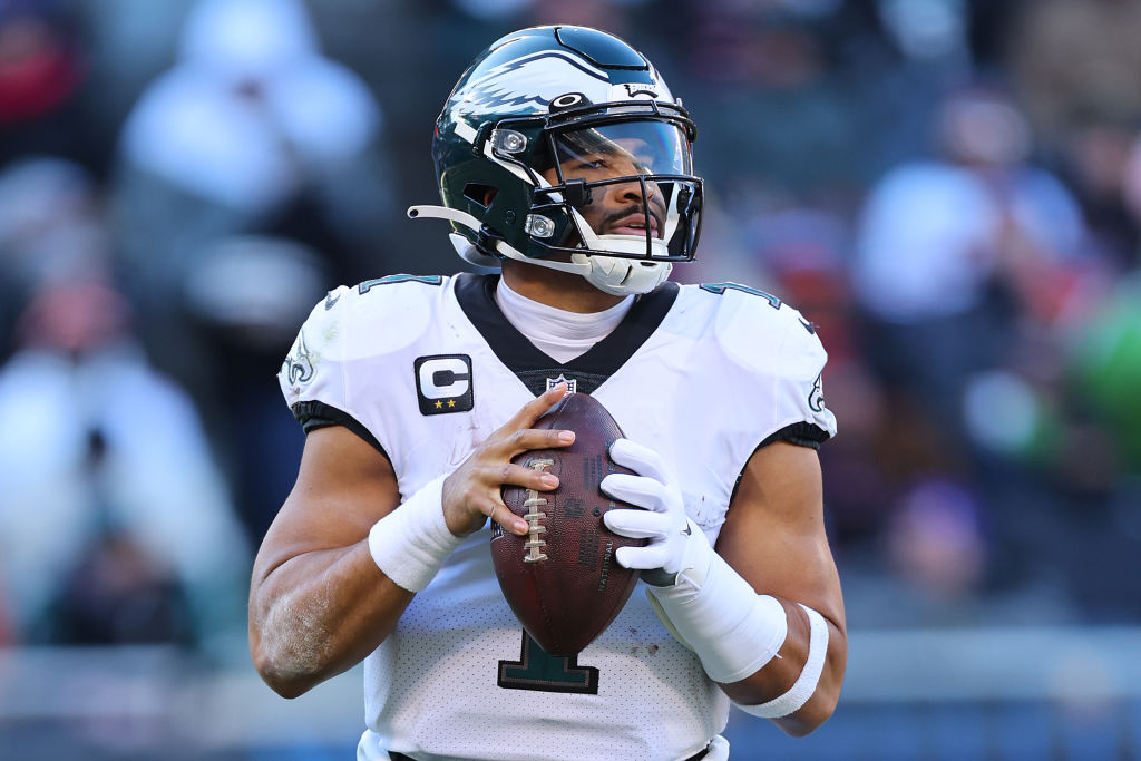CHICAGO, ILLINOIS - DECEMBER 18: Jalen Hurts #1 of the Philadelphia Eagles looks to pass against the Chicago Bears at Soldier Field on December 18, 2022 in Chicago, Illinois. (Photo by Michael Reaves/Getty Images)