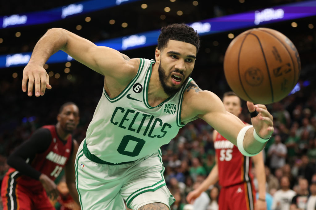 BOSTON, MASSACHUSETTS - MAY 19: Jayson Tatum #0 of the Boston Celtics dives for a lose ball against the Miami Heat during the fourth quarter in game two of the Eastern Conference Finals at TD Garden on May 19, 2023 in Boston, Massachusetts. (Photo by Adam Glanzman/Getty Images)