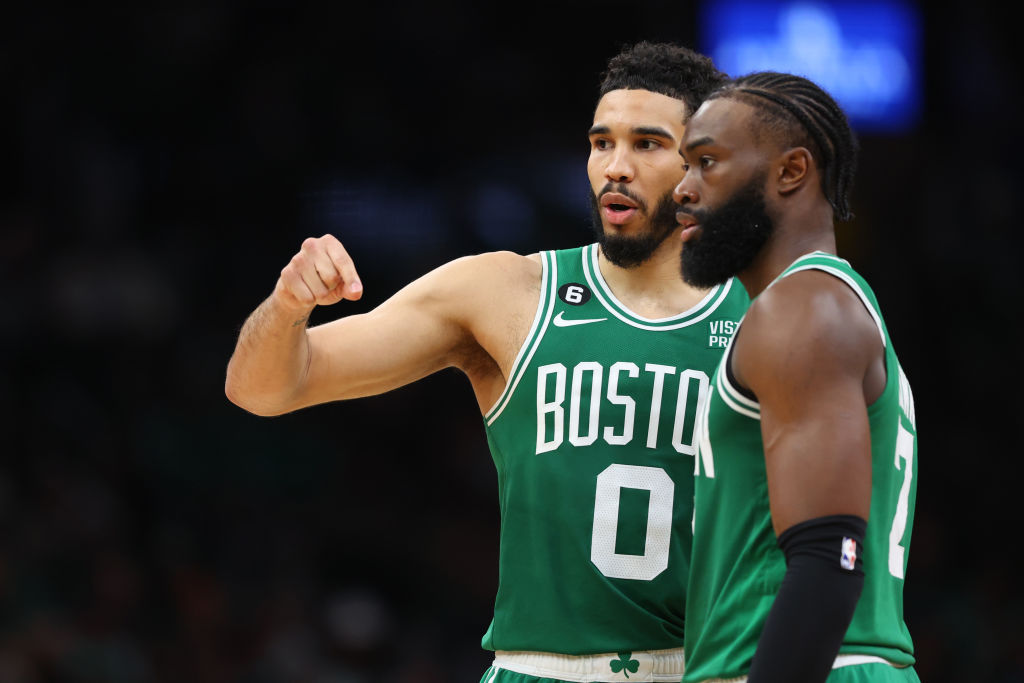 BOSTON, MASSACHUSETTS - MAY 25: Jayson Tatum #0 talks with Jaylen Brown #7 of the Boston Celtics against the Miami Heat during the fourth quarter in game five of the Eastern Conference Finals at TD Garden on May 25, 2023 in Boston, Massachusetts. (Photo by Maddie Meyer/Getty Images)
