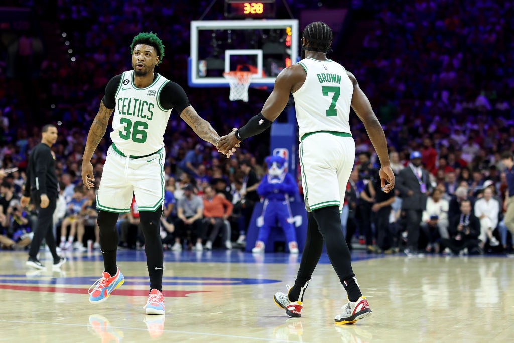 PHILADELPHIA, PENNSYLVANIA - MAY 07: Marcus Smart #36 and Jaylen Brown #7 of the Boston Celtics high five against the Philadelphia 76ers d1qin game four of the Eastern Conference Second Round Playoffs at Wells Fargo Center on May 07, 2023 in Philadelphia, Pennsylvania. (Photo by Tim Nwachukwu/Getty Images)