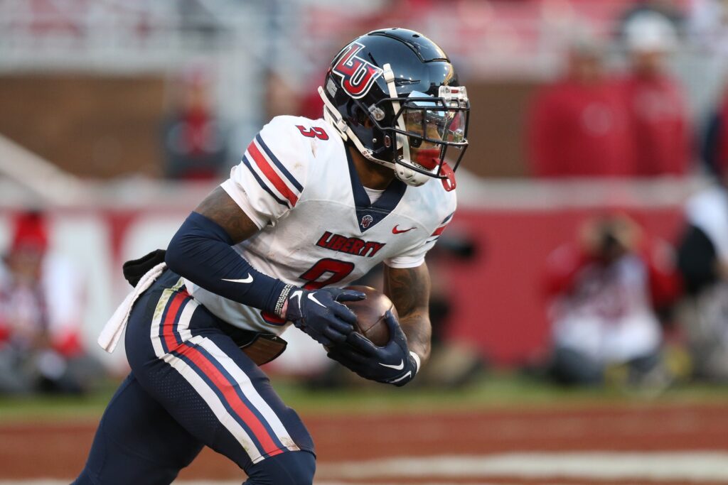 Nov 5, 2022; Fayetteville, Arkansas, USA; Liberty Flames wide receiver Demario Douglas (3) returns a kick during the second half against the Arkansas Razorbacks at Donald W. Reynolds Razorback Stadium. Liberty won 21-19. Credit: Nelson Chenault-USA TODAY Sports