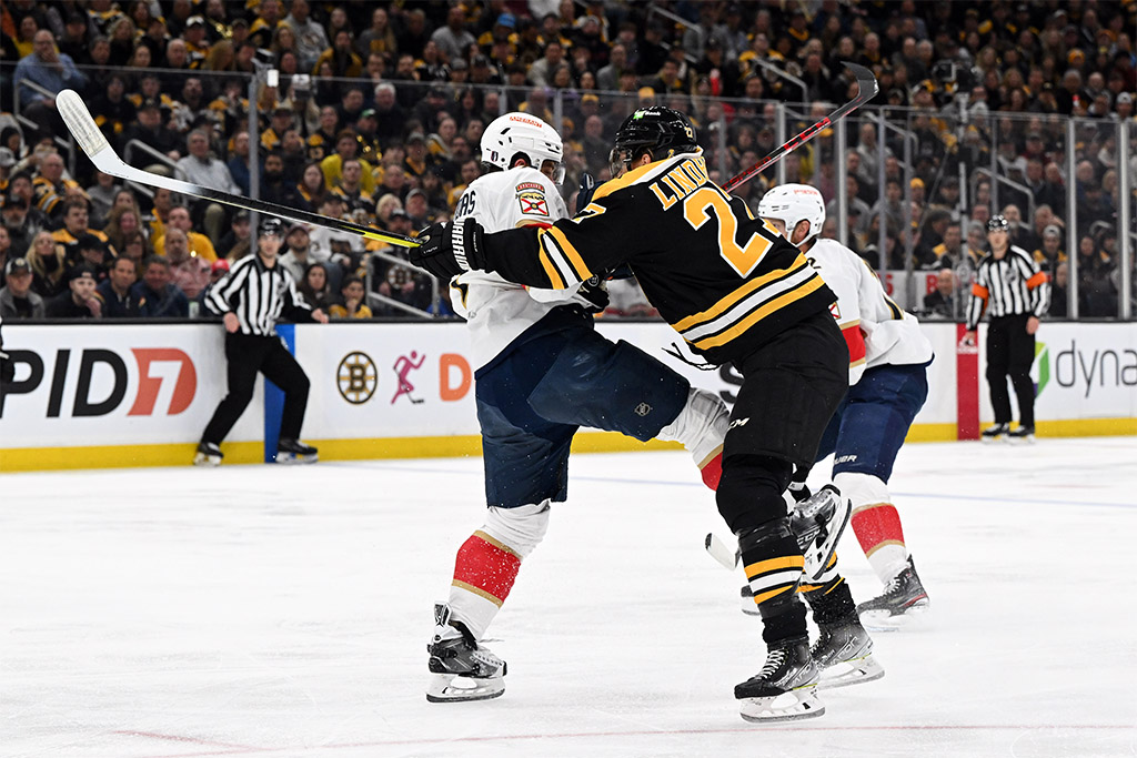 Apr 17, 2023; Boston, Massachusetts, USA; Boston Bruins defenseman Hampus Lindholm (27) checks Florida Panthers defenseman Radko Gudas (7) during the first period of game one of the first round of the 2023 Stanley Cup Playoffs at TD Garden. Mandatory Credit: Brian Fluharty-USA TODAY Sports