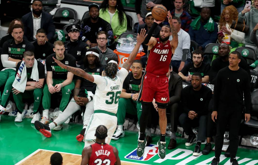 May 17, 2023; Boston, Massachusetts, USA; Miami Heat forward Caleb Martin (16) shoots against Boston Celtics guard Marcus Smart (36) during the second half in game one of the Eastern Conference Finals for the 2023 NBA playoffs at TD Garden. Credit: Paul Rutherford-USA TODAY Sports