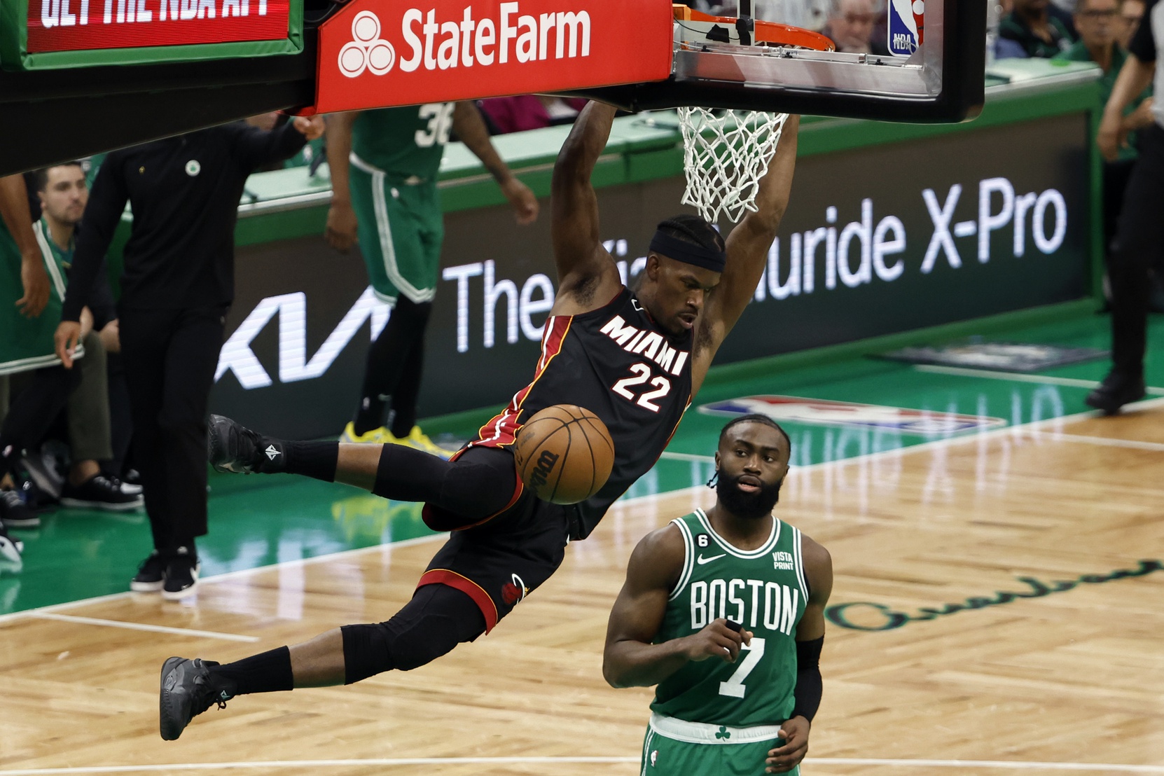 May 29, 2023; Boston, Massachusetts, USA; Miami Heat forward Jimmy Butler (22) dunks against Boston Celtics guard Jaylen Brown (7) during the fourth quarter of game seven of the Eastern Conference Finals for the 2023 NBA playoffs at TD Garden. Credit: Winslow Townson-USA TODAY Sports