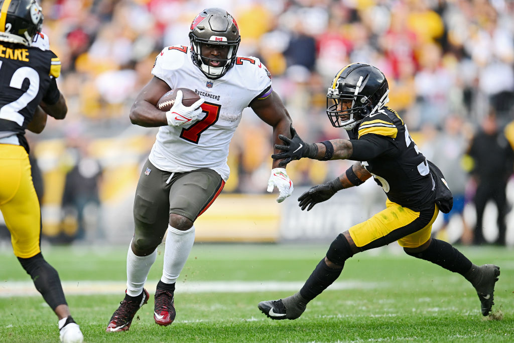 PITTSBURGH, PENNSYLVANIA - OCTOBER 16: Leonard Fournette #7 of the Tampa Bay Buccaneers runs the ball for a first down against Arthur Maulet #35 of the Pittsburgh Steelers during the fourth quarter at Acrisure Stadium on October 16, 2022 in Pittsburgh, Pennsylvania. (Photo by Joe Sargent/Getty Images)