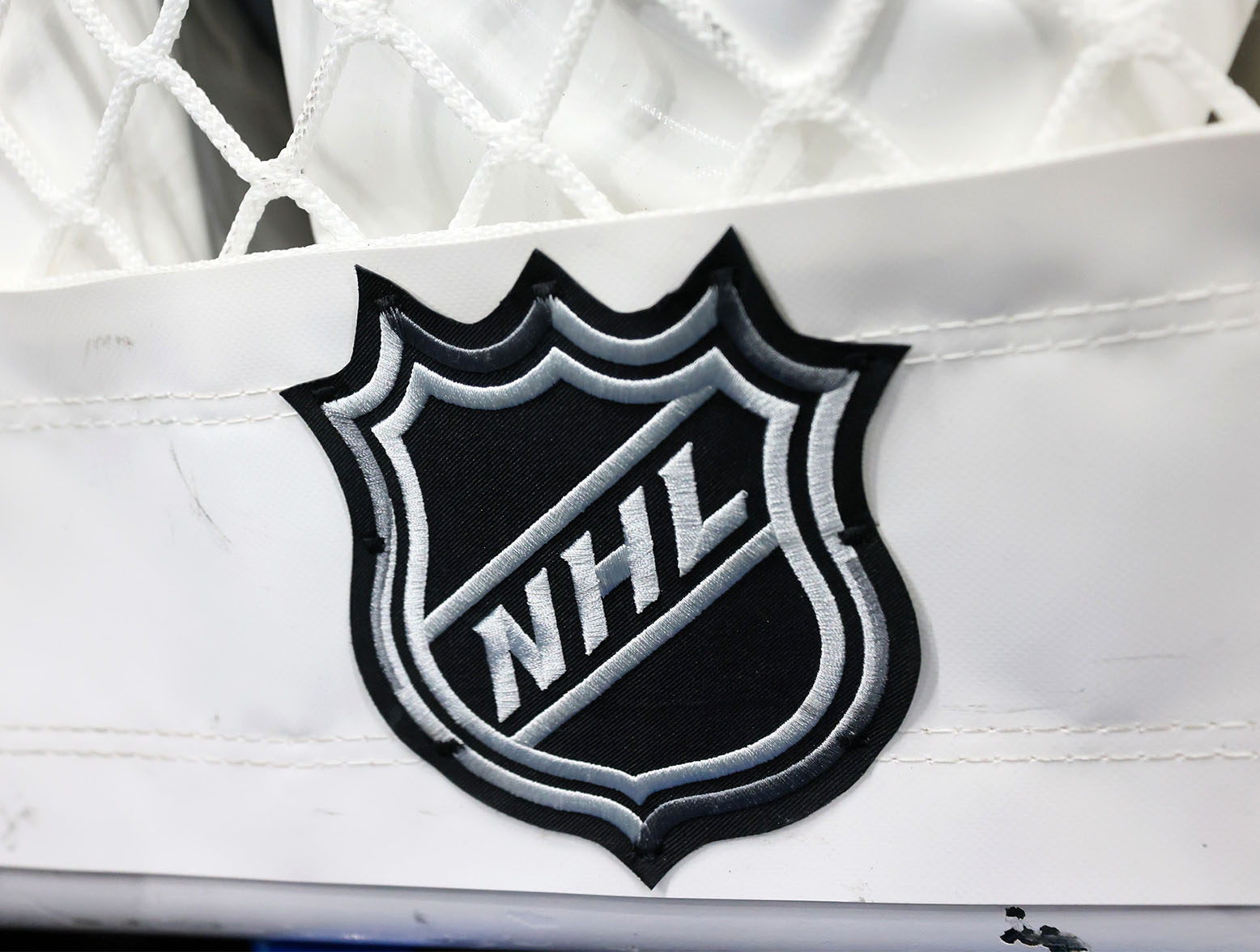 A closeup view of the NHL logo on a hockey net prior to an NHL game. (Bruce Bennett/Getty Images)