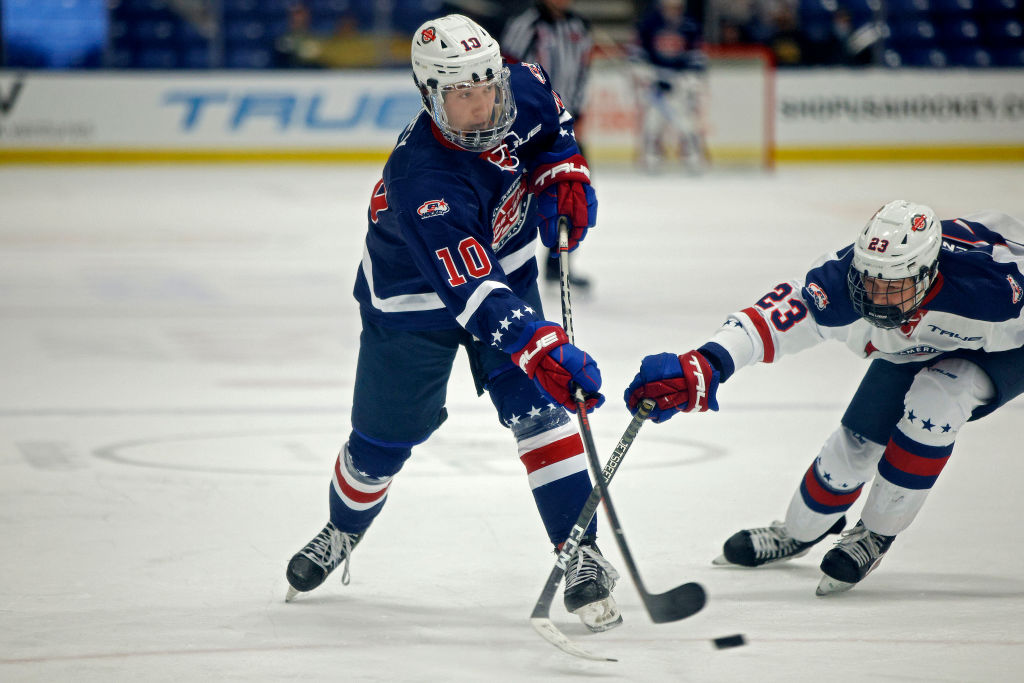 PLYMOUTH, MICHIGAN - JANUARY 16: Nathan Tobey #10 of the United States shoots the puck against Beckett Hendrickson #23 during the third period of the 2023 BioSteel All-American hockey game at USA Hockey Arena on January 16, 2023 in Plymouth, Michigan. (Photo by Mike Mulholland/Getty Images)