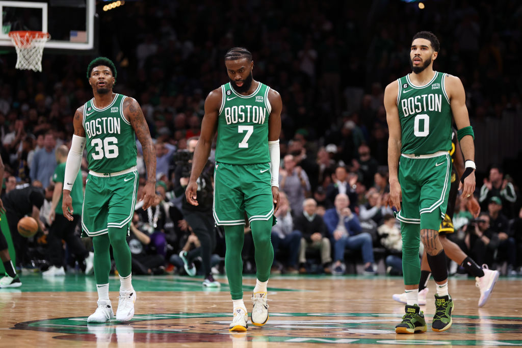 Marcus Smart, Jaylen Brown, and Jayson Tatum of the Boston Celtics look on during overtime against the Golden State Warriors at TD Garden. (Maddie Meyer/Getty Images)