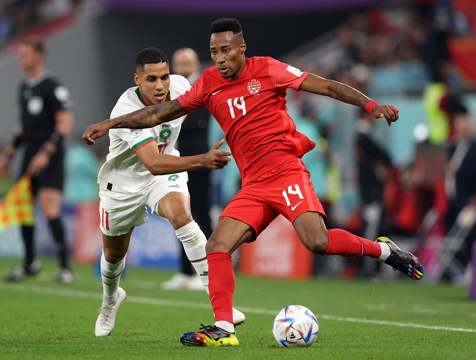 DOHA, QATAR - DECEMBER 01: Mark-Anthony Kaye of Canada controls the ball whilst under pressure from Abdelhamid Sabiri of Morocco during the FIFA World Cup Qatar 2022 Group F match between Canada and Morocco at Al Thumama Stadium on December 01, 2022 in Doha, Qatar. (Photo by Richard Heathcote/Getty Images)