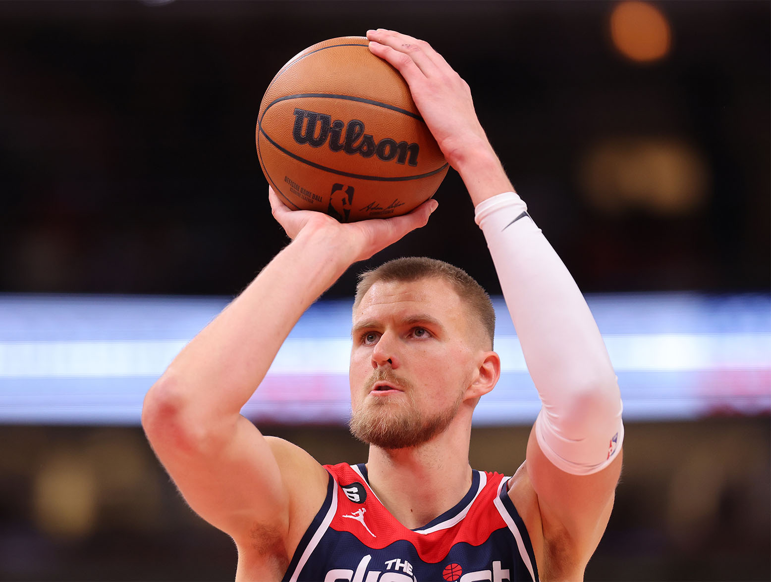 CHICAGO, ILLINOIS - DECEMBER 07: Kristaps Porzingis #6 of the Washington Wizards shoots a free throw against the Chicago Bulls during the second half at United Center on December 07, 2022 in Chicago, Illinois. NOTE TO USER: User expressly acknowledges and agrees that, by downloading and or using this photograph, User is consenting to the terms and conditions of the Getty Images License Agreement. (Photo by Michael Reaves/Getty Images)