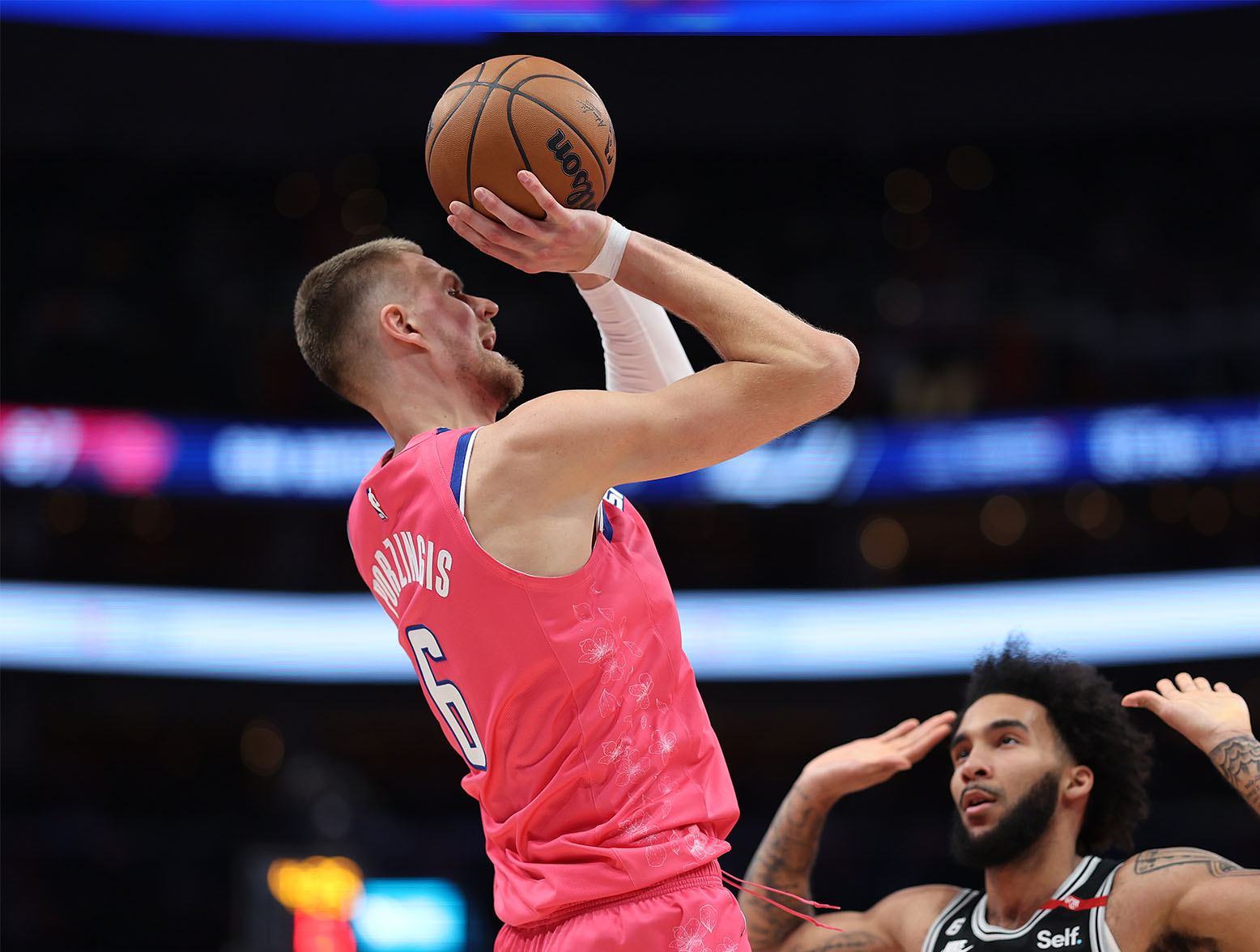 WASHINGTON, DC - MARCH 24: Kristaps Porzingis #6 of the Washington Wizards shoots against the San Antonio Spurs during the second half at Capital One Arena on March 24, 2023 in Washington, DC. NOTE TO USER: User expressly acknowledges and agrees that, by downloading and or using this photograph, User is consenting to the terms and conditions of the Getty Images License Agreement. (Photo by Patrick Smith/Getty Images)