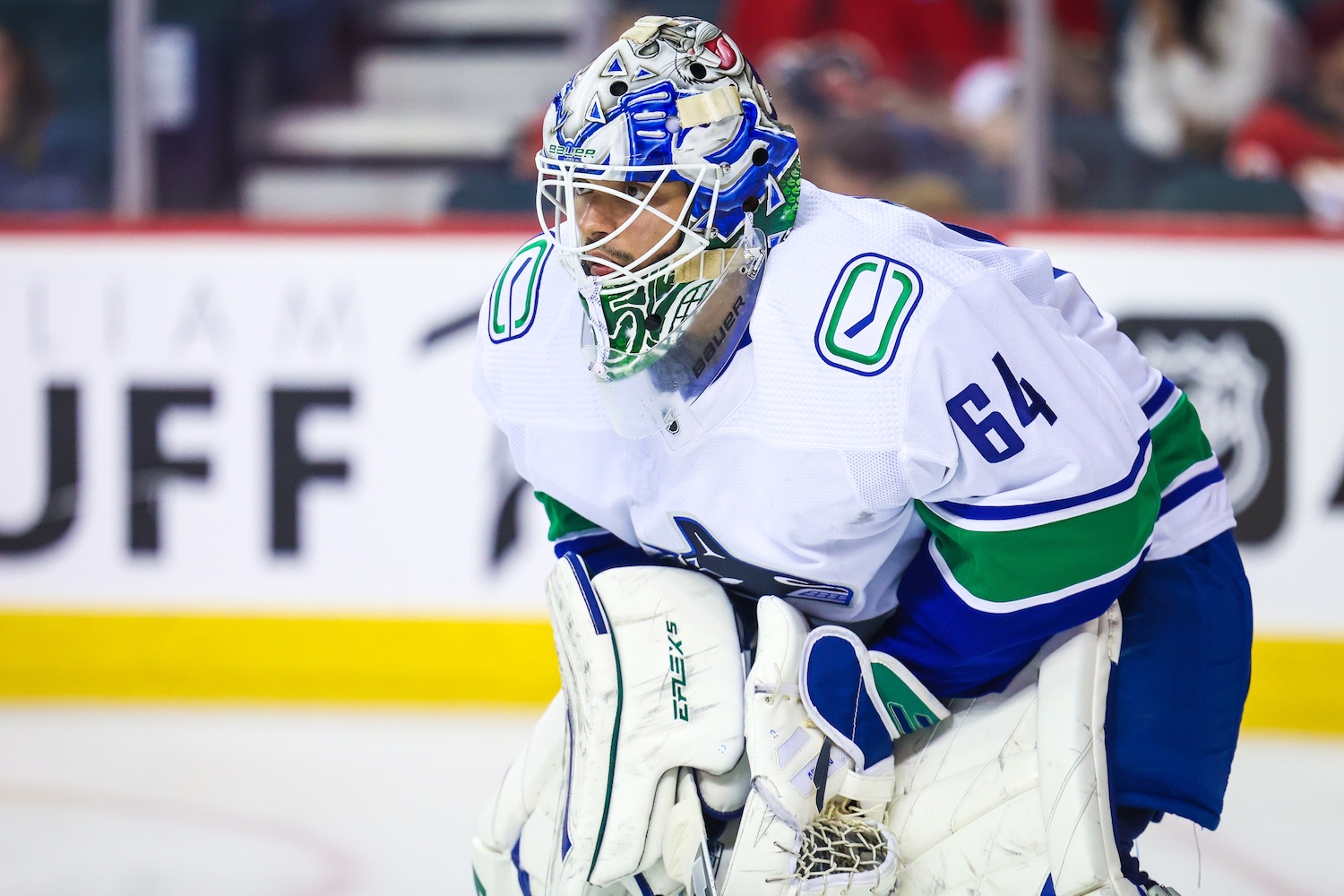 Sep 25, 2022; Calgary, Alberta, CAN; Vancouver Canucks goaltender Michael DiPietro (64) during the third period against the Calgary Flames at Scotiabank Saddledome. Mandatory Credit: Sergei Belski-USA TODAY Sports