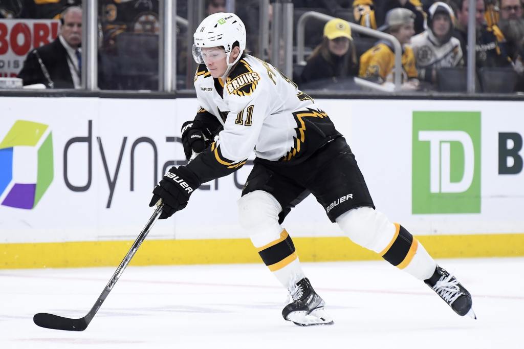 Dec 3, 2022; Boston, Massachusetts, USA; Boston Bruins center Trent Frederic (11) skates with the puck during the third period against the Colorado Avalanche at TD Garden. Mandatory Credit: Bob DeChiara-USA TODAY Sports