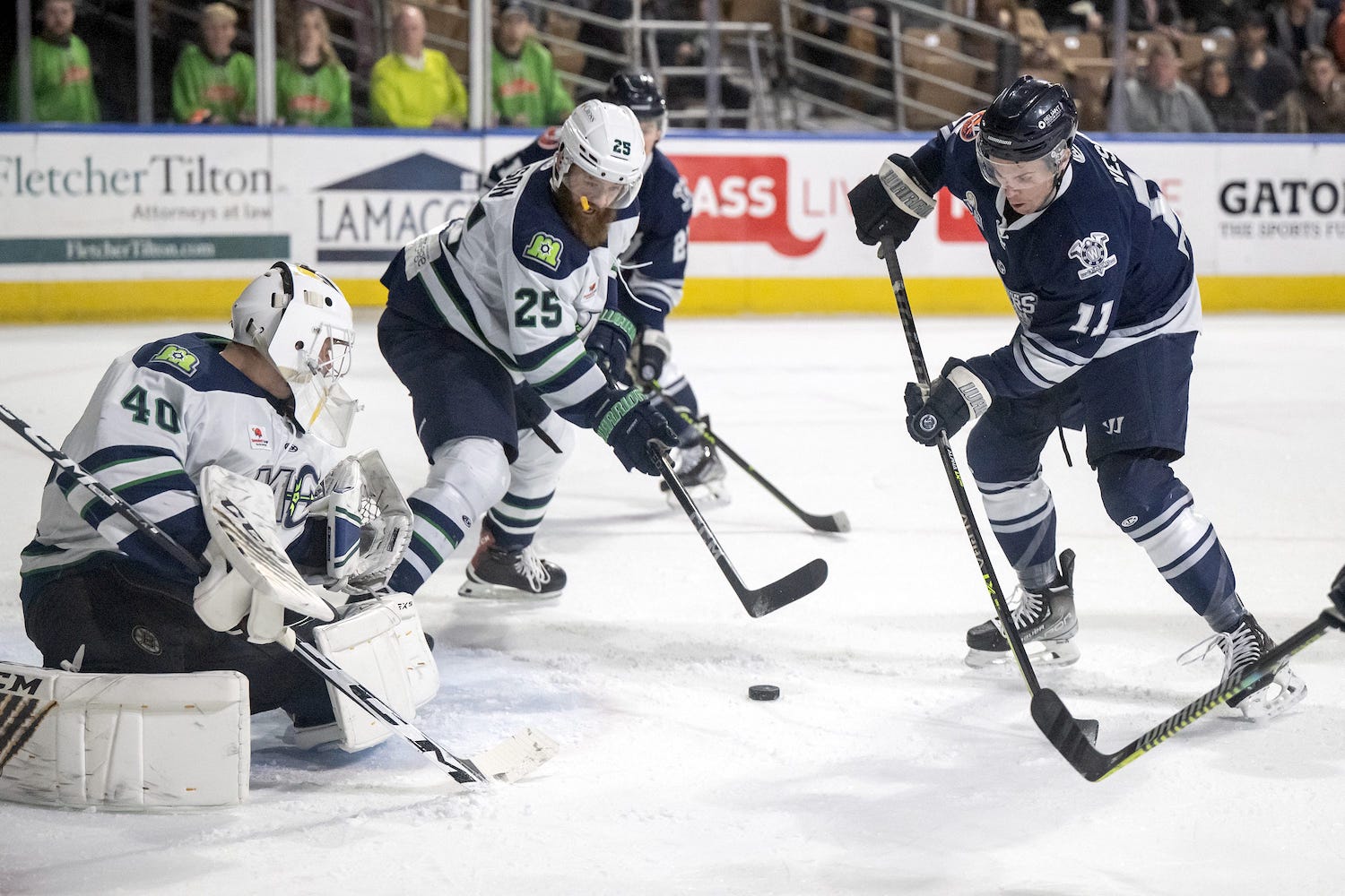 Worcester Railers forward Nolan Vesey can't get it past Maine Mariners goalie Michael DiPietro and defender Jacob Wilson. (Syndication: Worcester Telegram)