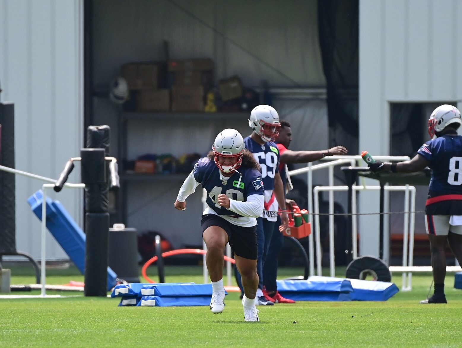 Jun 12, 2023; Foxborough, MA, USA; New England Patriots linebacker Jahlani Tavai (48) works against a resistance rope at the Patriots minicamp at Gillette Stadium. Credit: Eric Canha-USA TODAY Sports