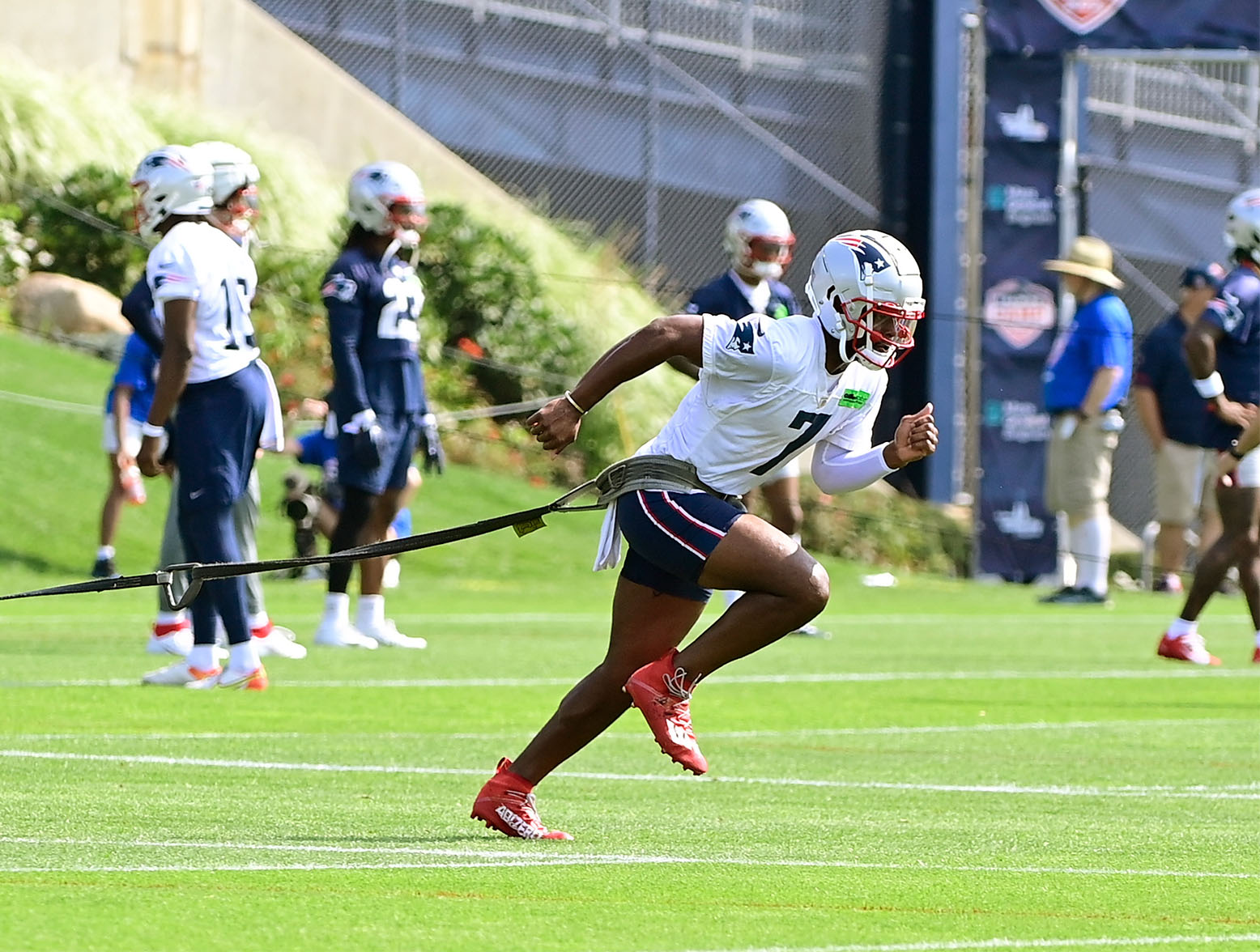 Jul 26, 2023; Foxborough, MA, USA; New England Patriots wide receiver JuJu Smith-Schuster (7) pulls a sled during training camp at Gillette Stadium. Mandatory Credit: Eric Canha-USA TODAY Sports