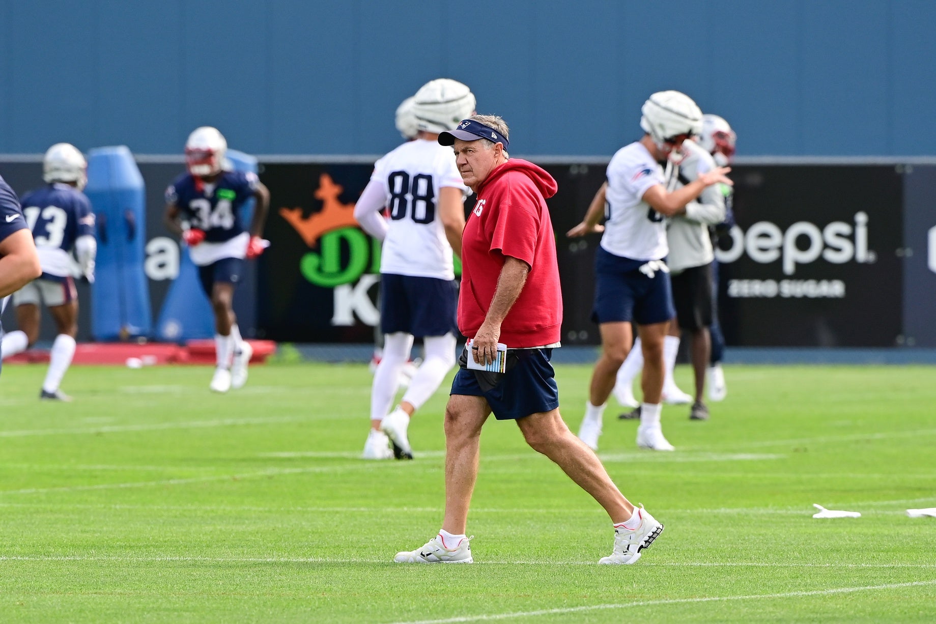 Jul 27, 2023; Foxborough, MA, USA; New England Patriots head coach Bill Belichick watches squads practice during training camp at Gillette Stadium. Credit: Eric Canha-USA TODAY Sports