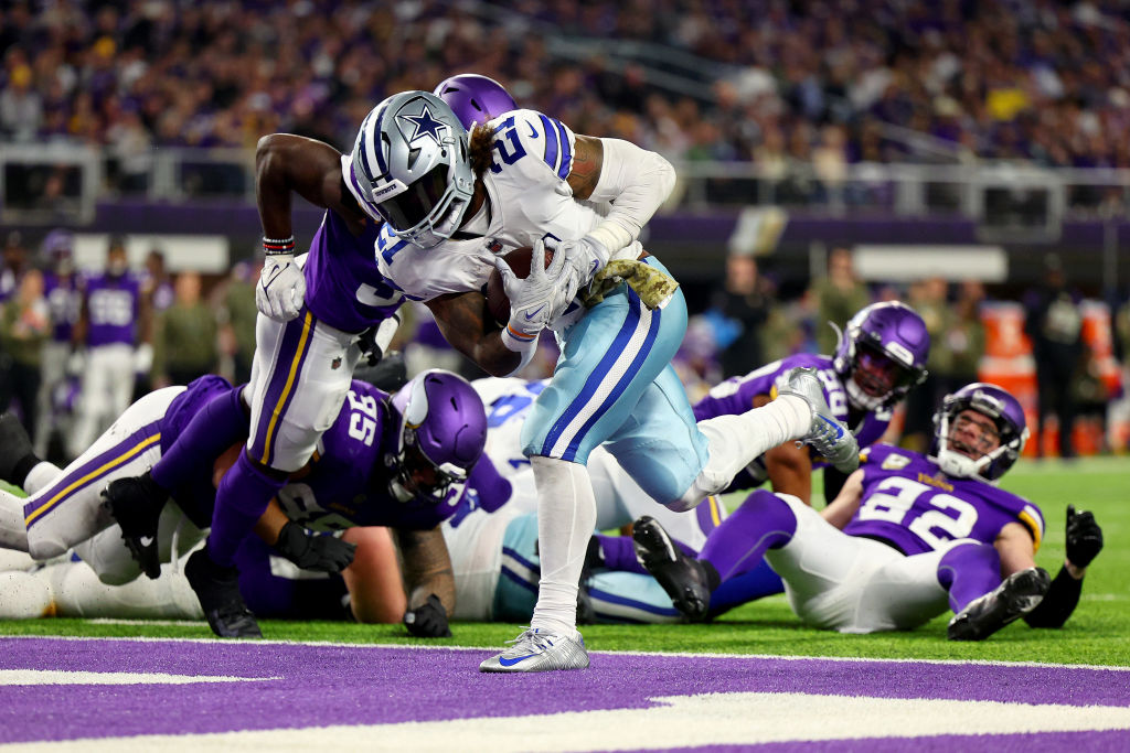 MINNEAPOLIS, MINNESOTA - NOVEMBER 20: Ezekiel Elliott #21 of the Dallas Cowboys rushes for a touchdown against the Minnesota Vikings during the third quarter at U.S. Bank Stadium on November 20, 2022 in Minneapolis, Minnesota. (Photo by Adam Bettcher/Getty Images)