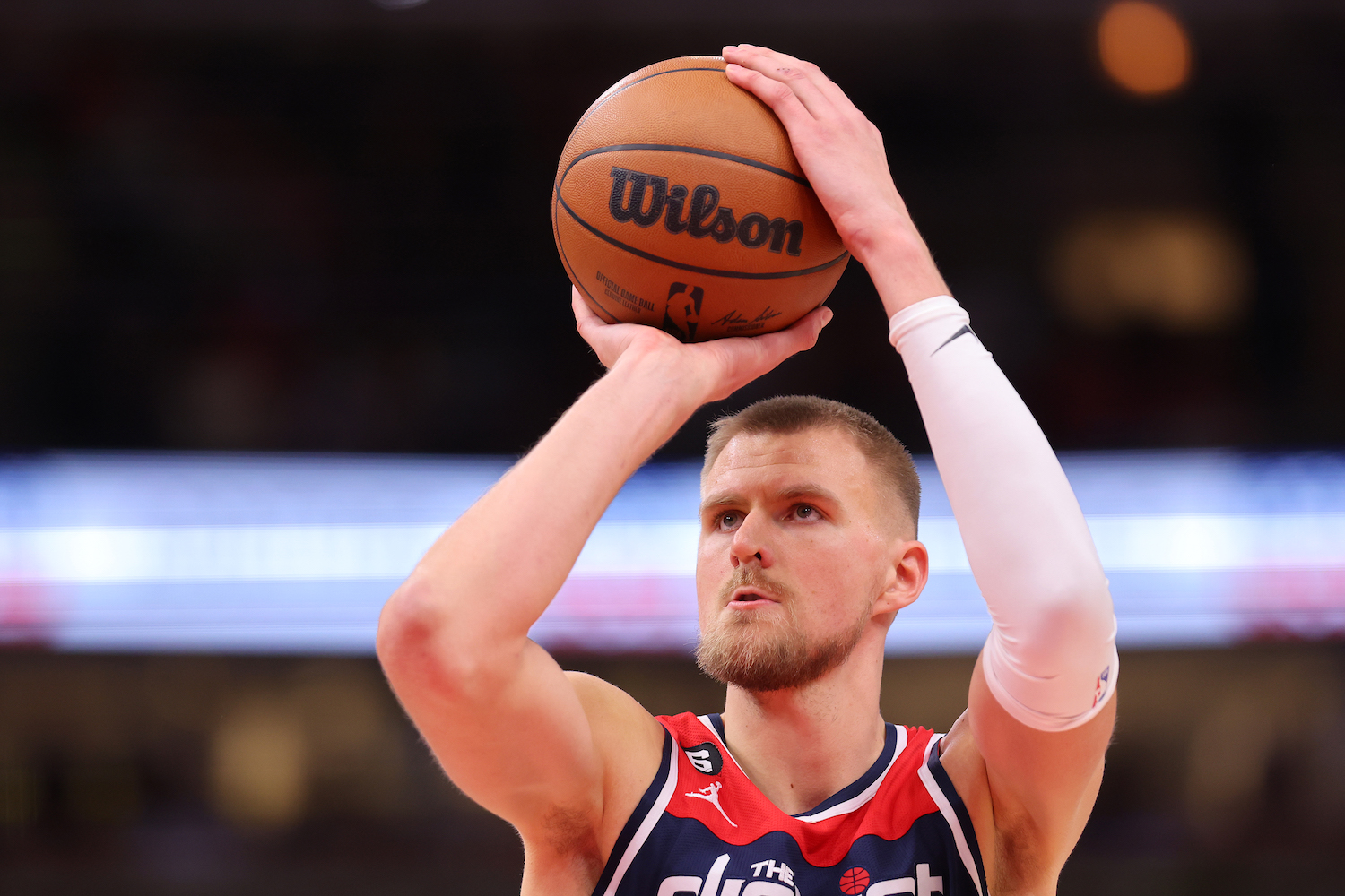 CHICAGO, ILLINOIS - DECEMBER 07: Kristaps Porzingis #6 of the Washington Wizards shoots a free throw against the Chicago Bulls during the second half at United Center on December 07, 2022 in Chicago, Illinois. NOTE TO USER: User expressly acknowledges and agrees that, by downloading and or using this photograph, User is consenting to the terms and conditions of the Getty Images License Agreement. (Photo by Michael Reaves/Getty Images)