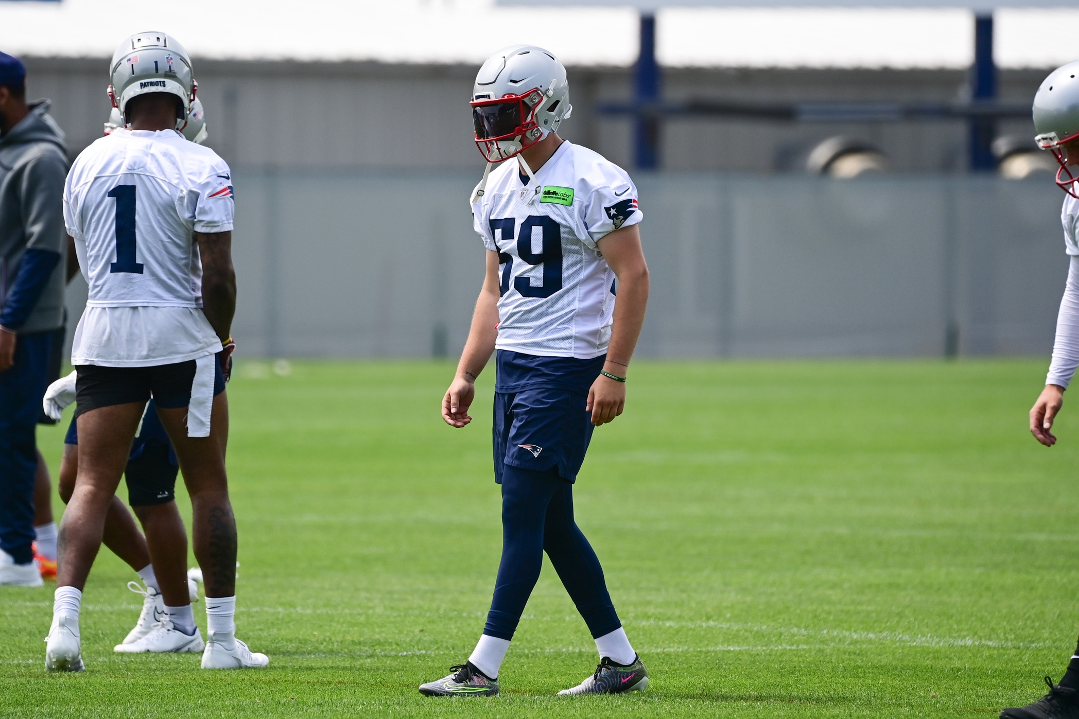 FOXBOROUGH, MA - AUGUST 11: New England Patriots running back J.J. Taylor  (42) catches a pass as offensive lineman James Ferentz (65) pulls out  during an NFL preseason game between the New