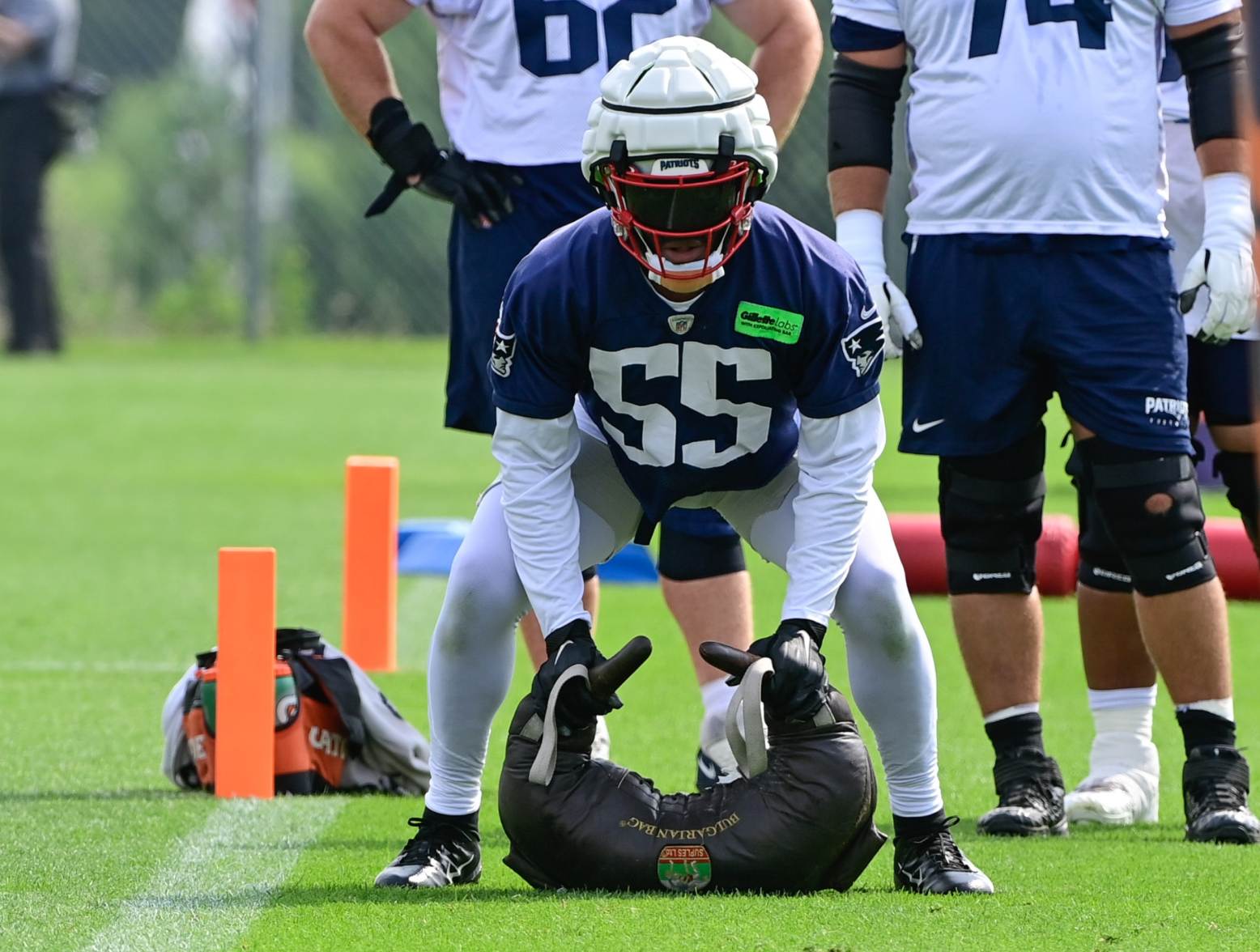 Jul 27, 2023; Foxborough, MA, USA; New England Patriots linebacker Josh Uche (55) works with a weight bag during training camp at Gillette Stadium. Credit: Eric Canha-USA TODAY Sports