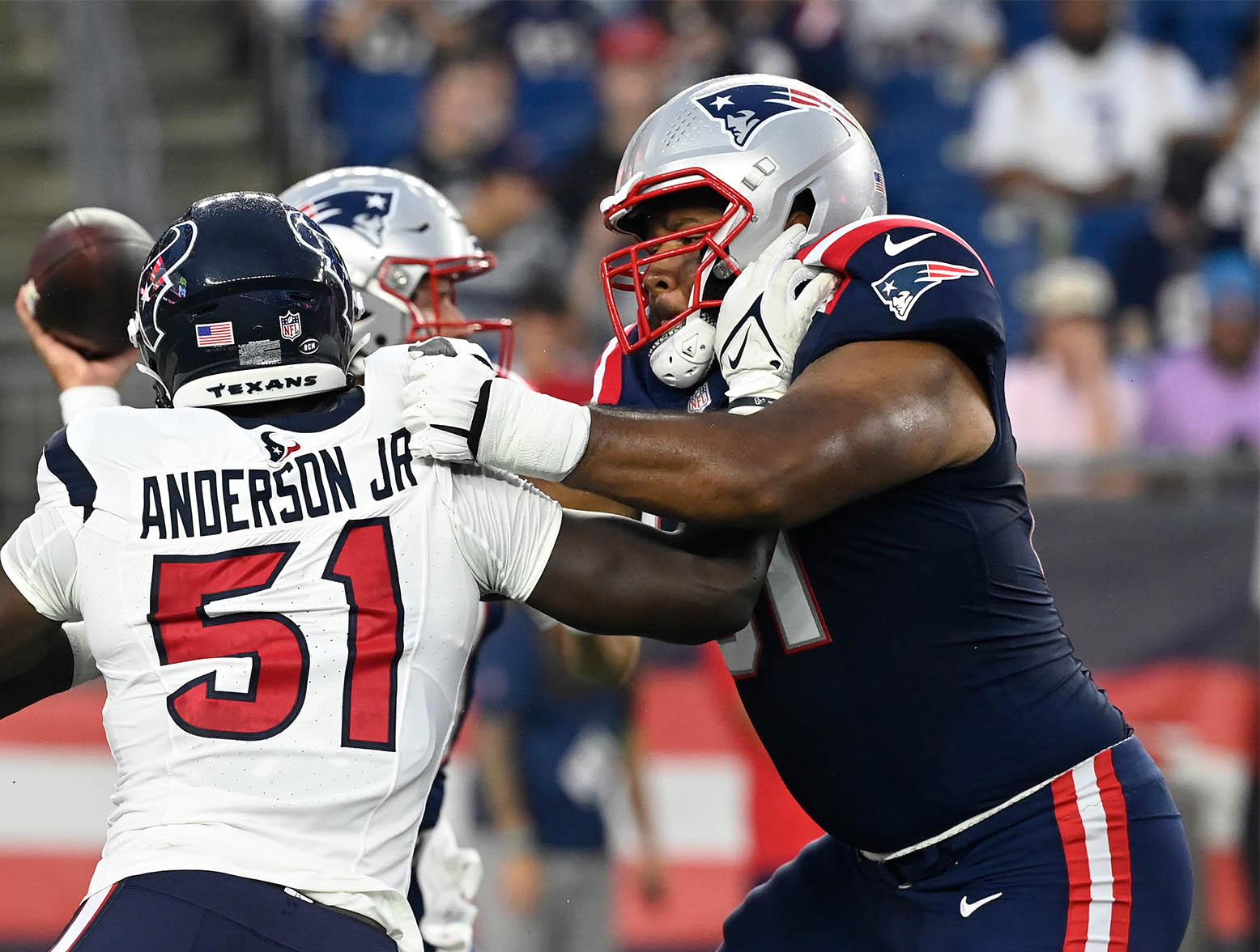 Aug 10, 2023; Foxborough, Massachusetts, USA; New England Patriots guard Sidy Sow (61) blocks Houston Texans defensive end Will Anderson Jr. (51) away from quarterback Bailey Zappe (4) during the first half at Gillette Stadium. Mandatory Credit: Eric Canha-USA TODAY Sports