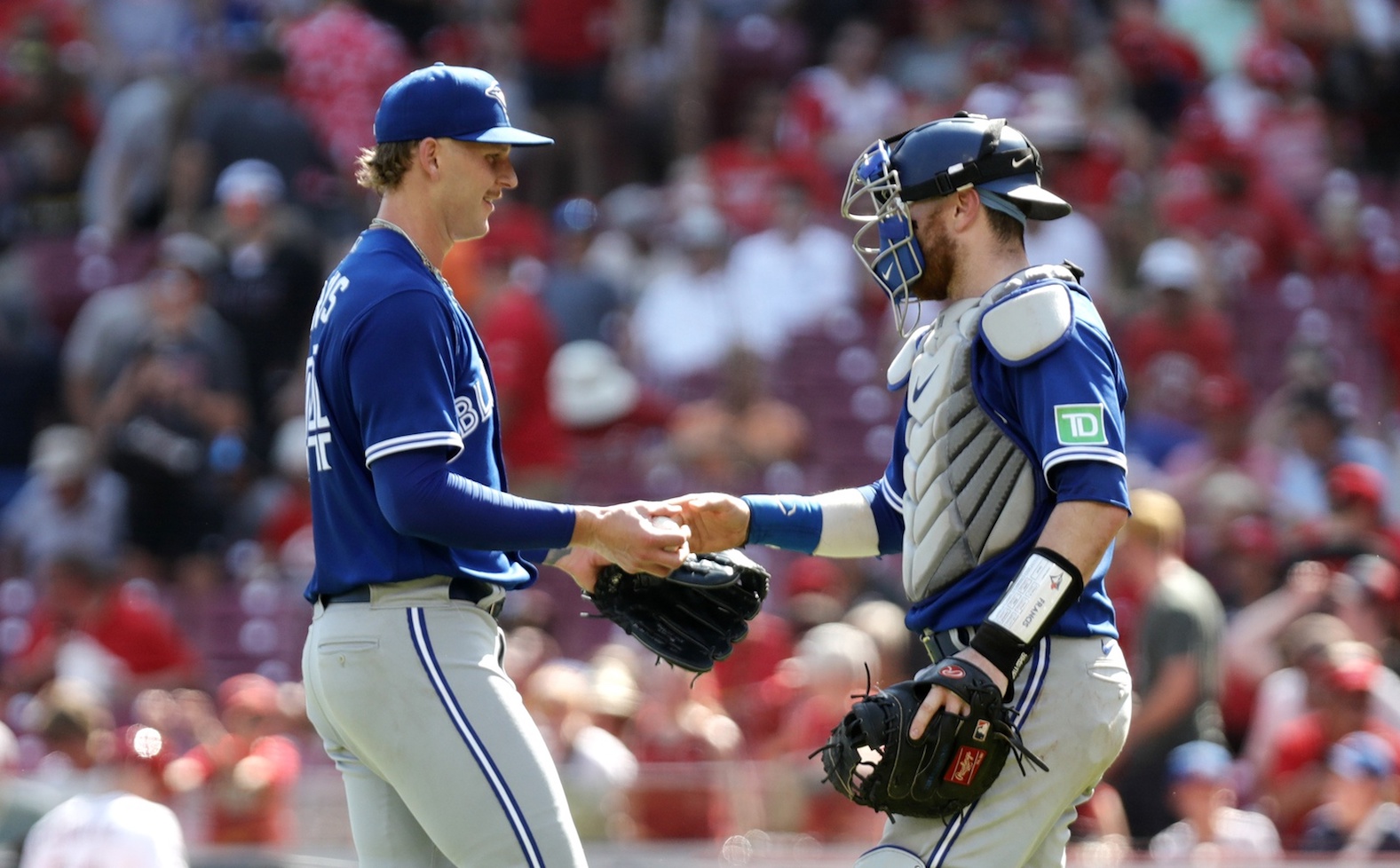 Aug 20, 2023; Cincinnati, Ohio, USA; Toronto Blue Jays relief pitcher Bowden Francis (44) reacts with catcher Danny Jansen (9) after the Blue Jays defeated the Cincinnati Reds at Great American Ball Park. Mandatory Credit: David Kohl-USA TODAY Sports