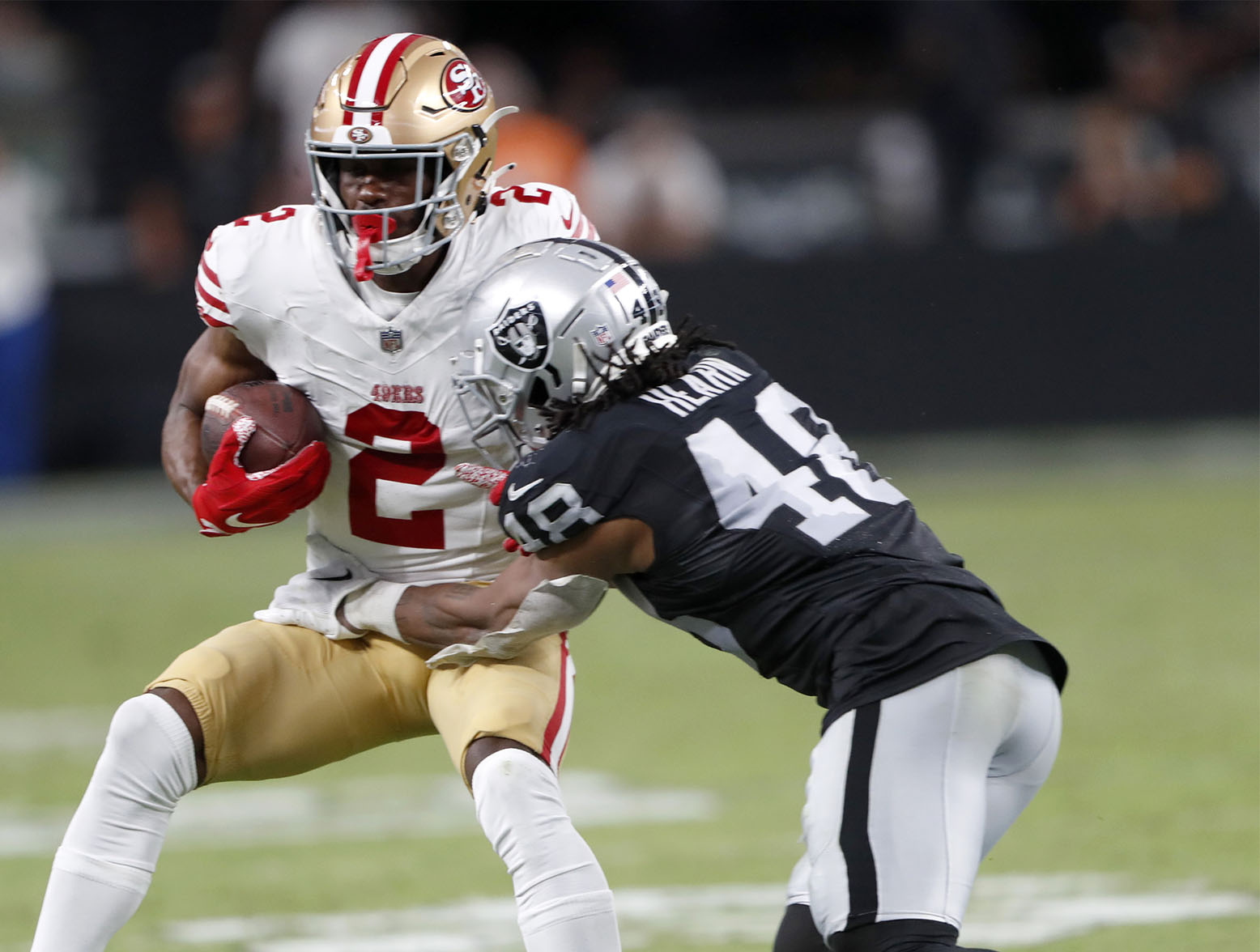 LAS VEGAS, NEVADA - AUGUST 13: Wide receiver Isaiah Winstead #2 of the San Francisco 49ers is tackled by cornerback Azizi Hearn #48 of the Las Vegas Raiders after a reception during the fourth quarter of a preseason game at Allegiant Stadium on August 13, 2023 in Las Vegas, Nevada. The Raiders beat the 49ers 34-7. (Photo by Steve Marcus/Getty Images)