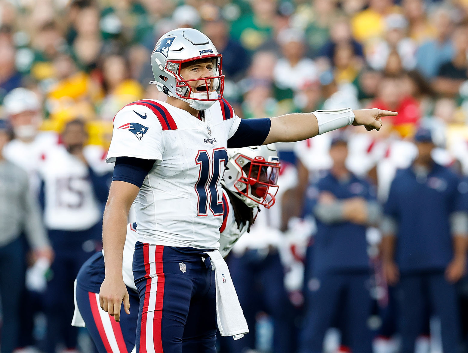 GREEN BAY, WISCONSIN - AUGUST 19: Mac Jones #10 of the New England Patriots calls out a play during the first half against the Green Bay Packers during a preseason game at Lambeau Field on August 19, 2023 in Green Bay, Wisconsin. (Photo by John Fisher/Getty Images)