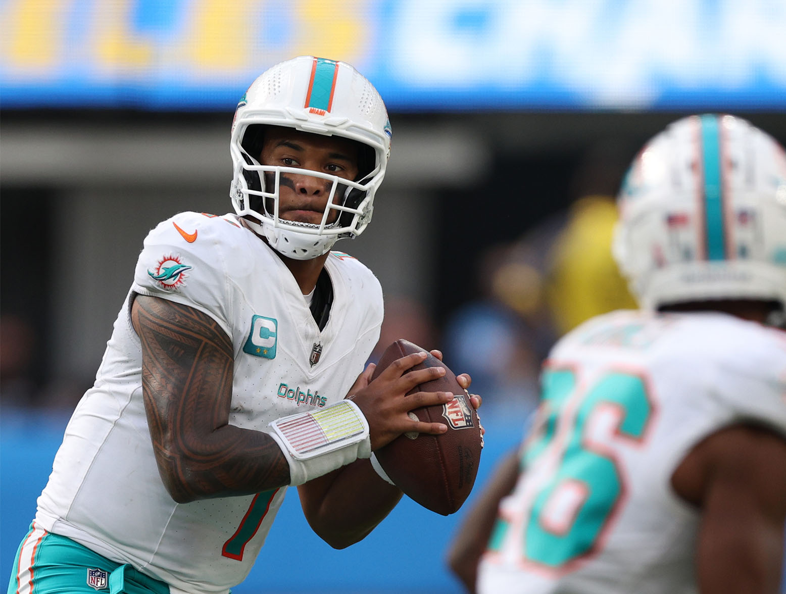 INGLEWOOD, CALIFORNIA - SEPTEMBER 10: Tua Tagovailoa #1 of the Miami Dolphins looks to pass in the third quarter during a 36-34 Dolphins win over the Los Angeles Chargers at SoFi Stadium on September 10, 2023 in Inglewood, California. (Photo by Harry How/Getty Images)