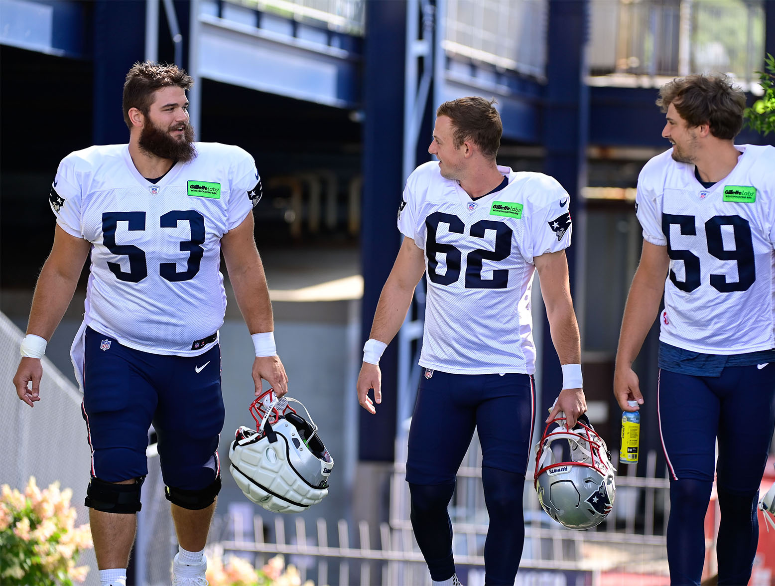 Aug 3, 2023; Foxborough, MA, USA; New England Patriots center Jake Andrews (53) chats with place kicker Chad Ryland (62) and punter Bryce Baringer (59) on their way to the practice fields at training camp at Gillette Stadium. Mandatory Credit: Eric Canha-USA TODAY Sports