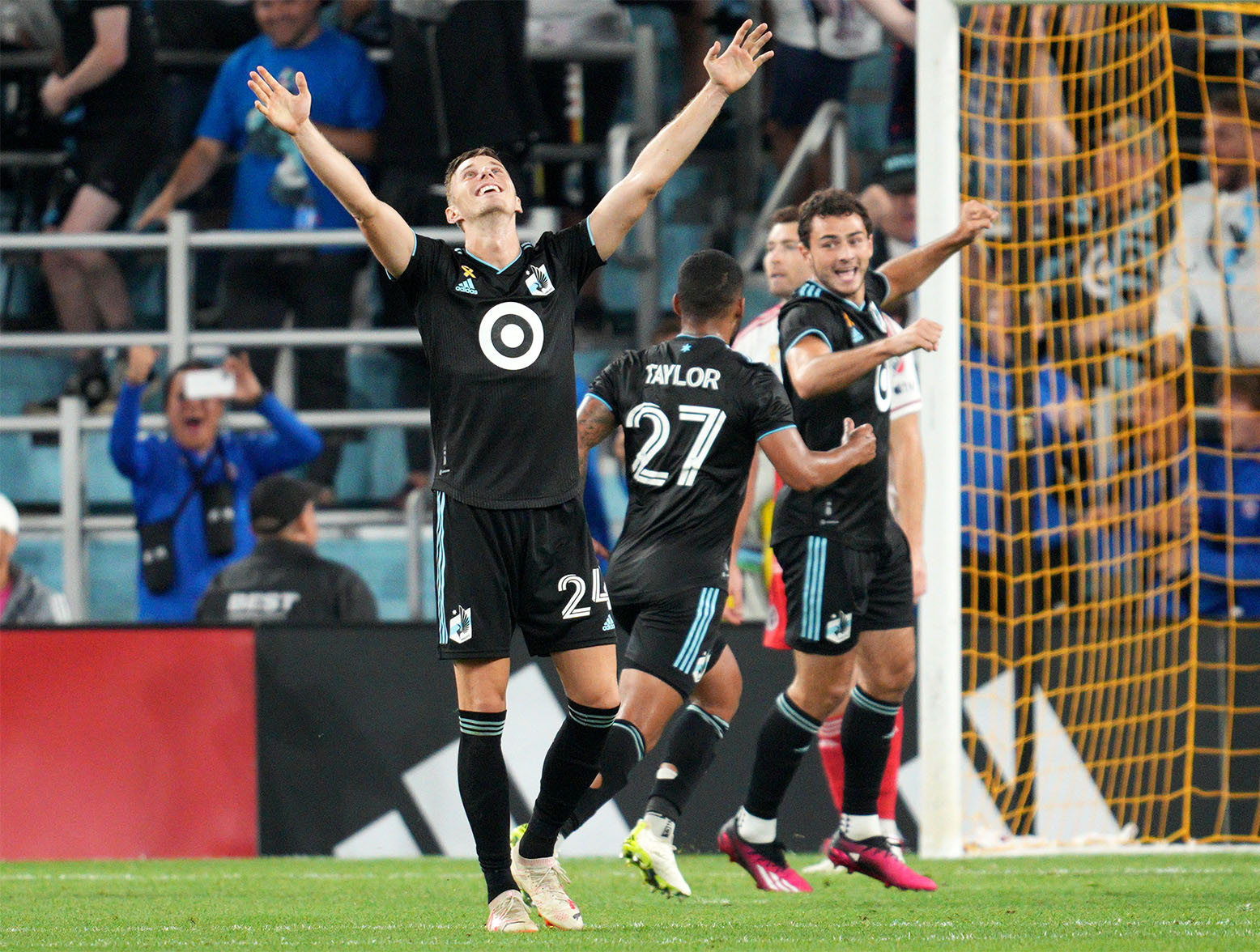 Sep 9, 2023; Saint Paul, Minnesota, USA; Minnesota United midfielder Jan Gregus (24) and defender D.J. Taylor (27) and defender Devin Padelford (right) react after a goal by midfielder Franco Fragapane (not pictured) against the New England Revolution during stoppage time at Allianz Field. Mandatory Credit: Matt Blewett-USA TODAY Sports