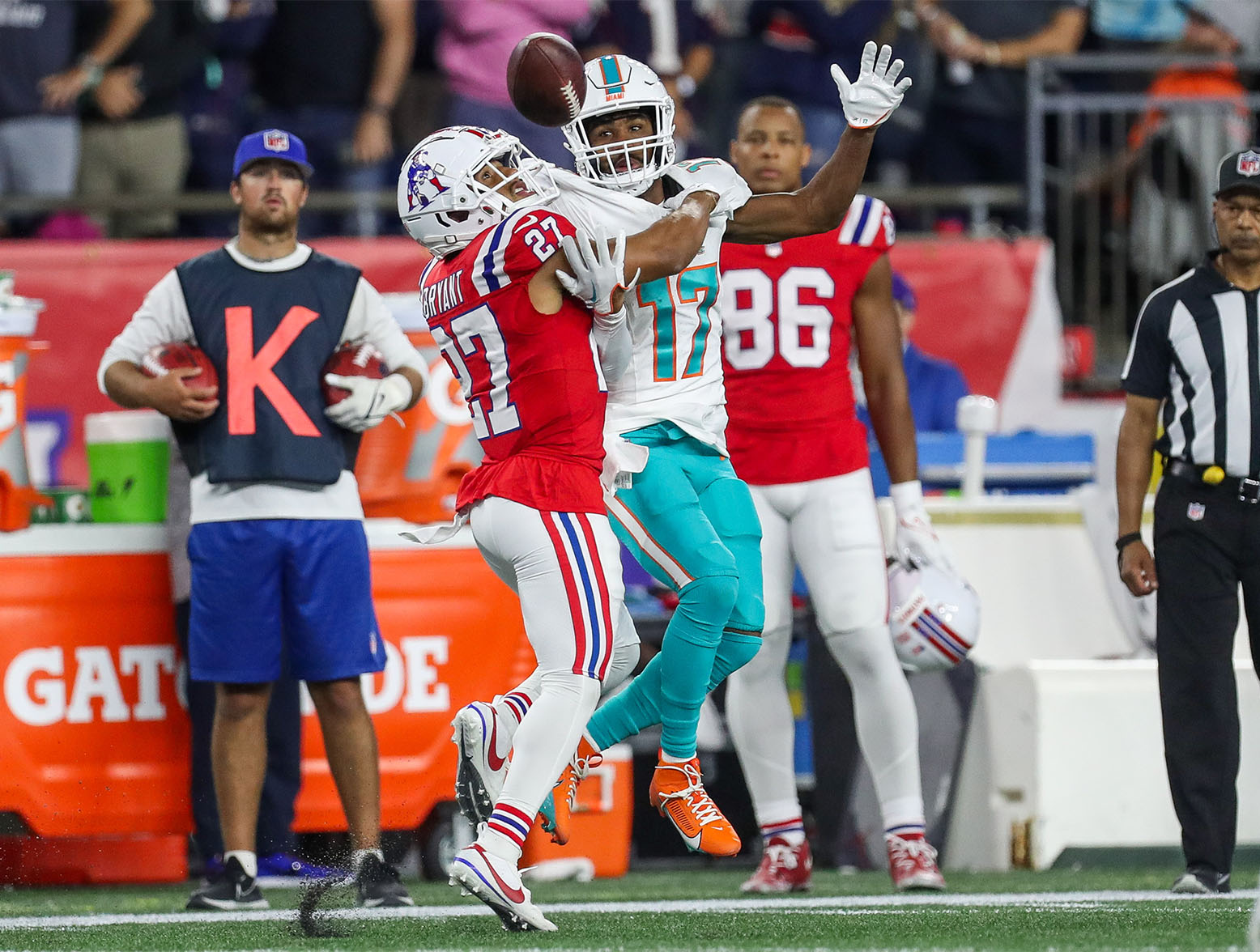 Sep 17, 2023; Foxborough, Massachusetts, USA; New England Patriots cornerback Myles Bryant (27) breaks up a pass to Miami Dolphins receiver Jaylen Waddle (17) during the first half at Gillette Stadium. Mandatory Credit: Paul Rutherford-USA TODAY Sports