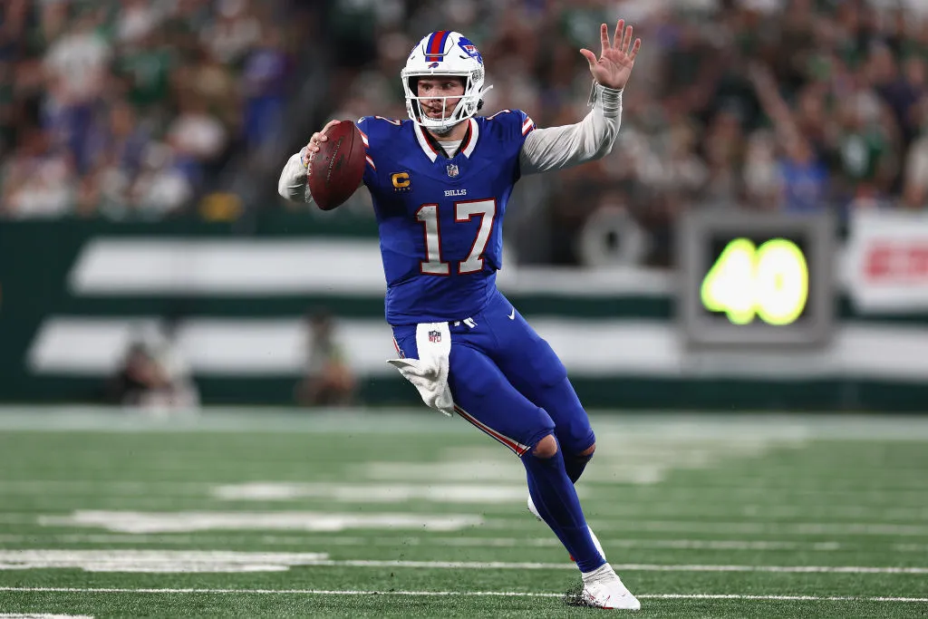 EAST RUTHERFORD, NEW JERSEY - SEPTEMBER 11: Quarterback Josh Allen #17 of the Buffalo Bills scrambles with the football during the second quarter of the NFL game against the New York Jets at MetLife Stadium on September 11, 2023 in East Rutherford, New Jersey. (Photo by Elsa/Getty Images)