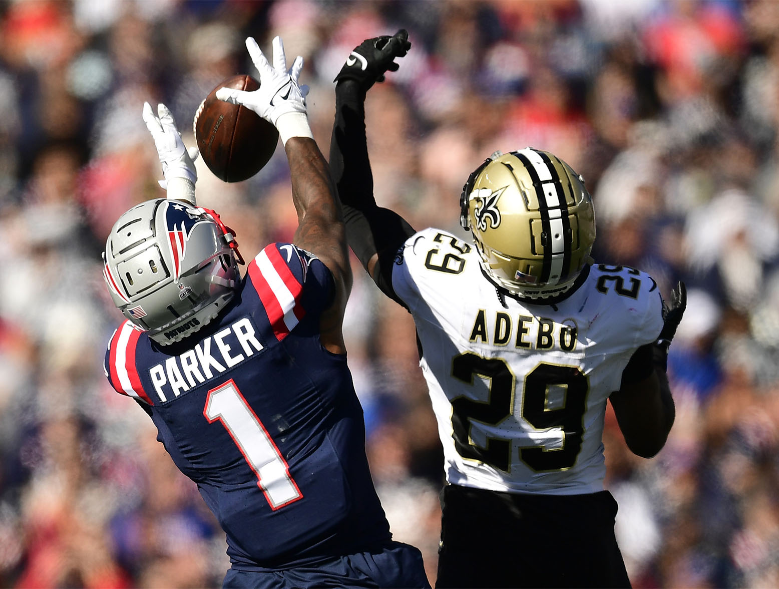 FOXBOROUGH, MASSACHUSETTS - OCTOBER 08: DeVante Parker #1 of the New England Patriots attempts to catch a pass while defended by Paulson Adebo #29 of the New Orleans Saints during the second quarter at Gillette Stadium on October 08, 2023 in Foxborough, Massachusetts. (Photo by Maddie Malhotra/Getty Images)